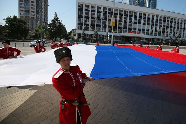 Des Cosaques pendant la célébration de la Journée du drapeau russe, Krasnodar. - Sputnik Afrique