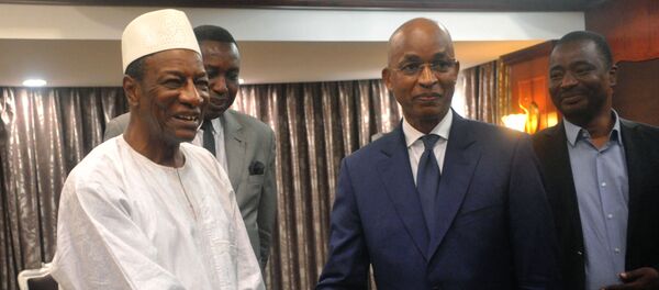 Les deux rivaux à la présidentielle guinéenne Alpha Condé (à gauche) et Cellou Dalein Diallo (à droite) - Sputnik Afrique