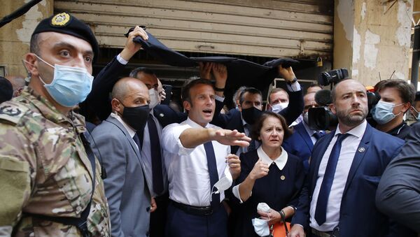 French President Emmanuel Macron gestures as he visits a devastated street of Beirut, Lebanon, on August 6, 2020 - Sputnik Afrique