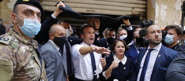 French President Emmanuel Macron gestures as he visits a devastated street of Beirut, Lebanon, on August 6, 2020 - Sputnik Afrique