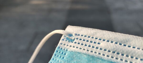 Un masque de protection chirurgical Un masque de protection chirurgical - Sputnik Afrique