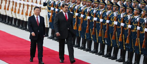 Xi Jinping et Nicolas Maduro Xi Jinping et Nicolas Maduro - Sputnik Afrique