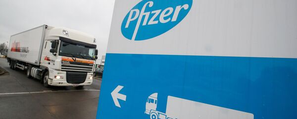 FILE PHOTO: A refrigerated truck leaves the Pfizer plant in Puurs - Sputnik Afrique