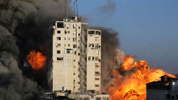 Une tour détruite dans une frappe israélienne contre Gaza, le 12 mai 2021 - Sputnik Afrique