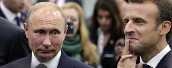 Macron et Poutine au Forum économique international de Saint-Pétersbourg 2018 - Sputnik Afrique