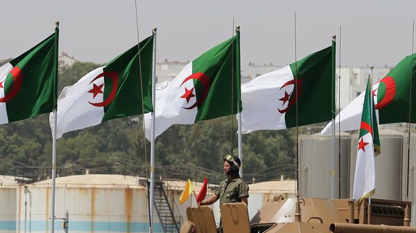 An Algerian soldier stands in a tank during a military parade to mark the 60th anniversary of the country's independence, Tuesday, July 5, 2022 in Algiers. - Sputnik Africa