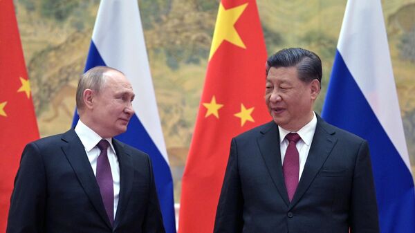 Vladimir Poutine en Chine, à côté de Xi Jinping, le 4 février 2022 - Sputnik Afrique