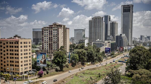 Traffic flows past the area where an iconic, century-old fig tree is placed after a presidential declaration was issued to save the centenary tree from being cut down to make way for a Chinese-funded highway in Westlands district of Nairobi, Kenya on November 12, 2020. - Sputnik Africa