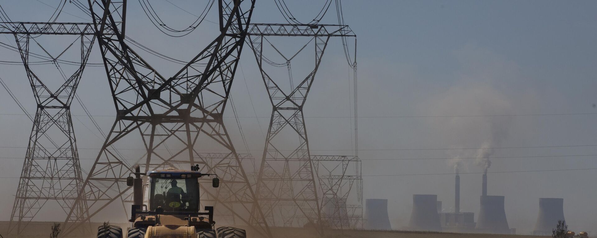The land is ploughed under electrical pylons leading from a coal-powered electricity generating plant east of Johannesburg, Thursday, Nov. 17 2022. - Sputnik Africa, 1920, 11.05.2023