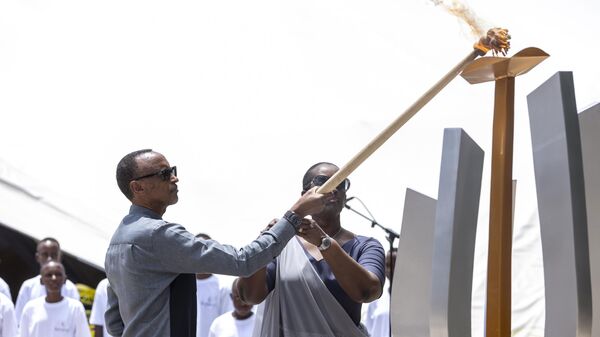 Rwanda's President Paul Kagame, left, and his wife Jeannette, light a commemorative flame during a ceremony at the Kigali Genocide Memorial in Kigali, Rwanda, Friday, April 7, 2023.  - Sputnik Africa
