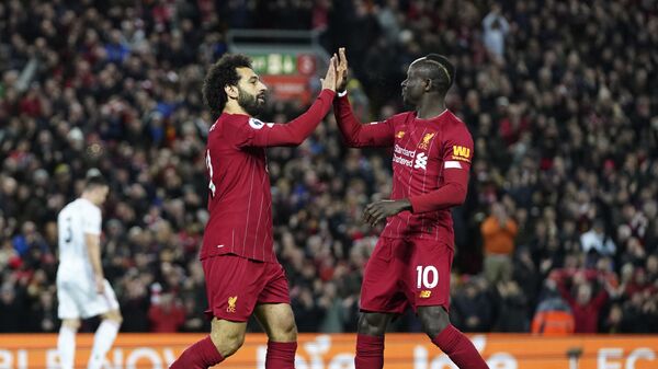 Liverpool's Mohamed Salah, front left, celebrates with Liverpool's Sadio Mane after scoring his side's opening goal during the English Premier League soccer match between Liverpool and Sheffield United at Anfield Stadium, Liverpool, England, Thursday, Jan. 2, 2020 - Sputnik Africa