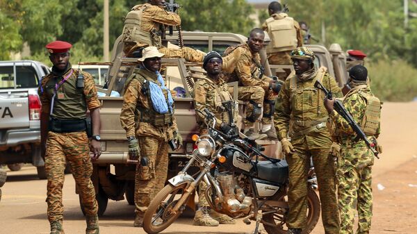 Soldiers loyal to Burkina Faso's latest coup leader Capt. Ibrahim Traore gather outside the National Assembly as Traore was appointed Burkina Faso's transitional president in Ouagadougou, Burkina Faso, Friday Oct. 14, 2022. - Sputnik Africa