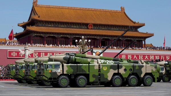 Chinese military vehicles carrying DF-21D anti-ship ballistic missiles, potentially capable of sinking a U.S. Nimitz-class aircraft carrier in a single strike, drive past Tiananmen Gate during a military parade to commemorate the 70th anniversary of the end of World War II, in Beijing on Sept. 3, 2015. - Sputnik Africa