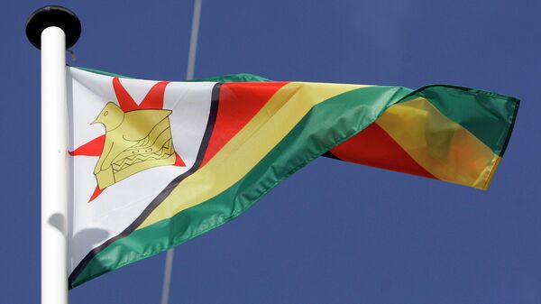 The flag of Zimbabwe blows in the win - Sputnik Africa
