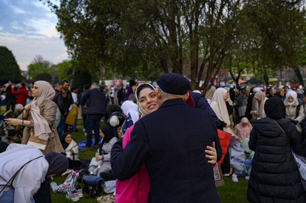 Muslims worshippers greet each other as they prepare to take part morning prayer on the first day of Eid al-Fitr at the Hagia Sofia, in Istanbul. - Sputnik Africa