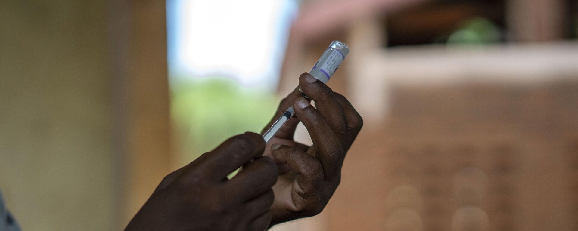 In this photo taken Wednesday, Dec. 11, 2019, health officials prepare to vaccine residents of the Malawi village of Tomali, where young children become test subjects for the world's first vaccine against malaria. - Sputnik Africa, 1920, 25.04.2024