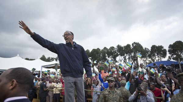 In this Saturday, Sept. 5, 2015 file photo, Rwanda's President Paul Kagame waves to the crowd before speaking at a baby gorilla naming ceremony in Kinigi, northern Rwanda - Sputnik Africa