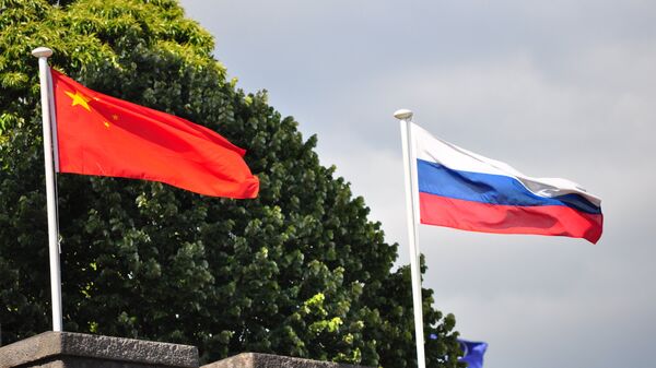 Chinese and Russian flags - Sputnik Africa