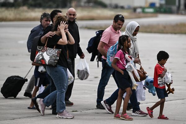 Greek nationals from Sudan arrive with a military C-27 plane at the military airport of Elefsina, south of Athens, on 25 April 2023.  - Sputnik Africa