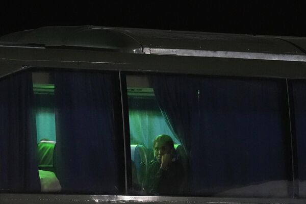 A woman looks out of the window of a bus at Cyprus&#x27; Joint Rescue Coordination Center adjacent to the island nation&#x27;s main Larnaca airport, that will transport approximately 40 British nationals evacuated from Sudan to accommodation on the island nation before repatriation on 25 April 2023. - Sputnik Africa