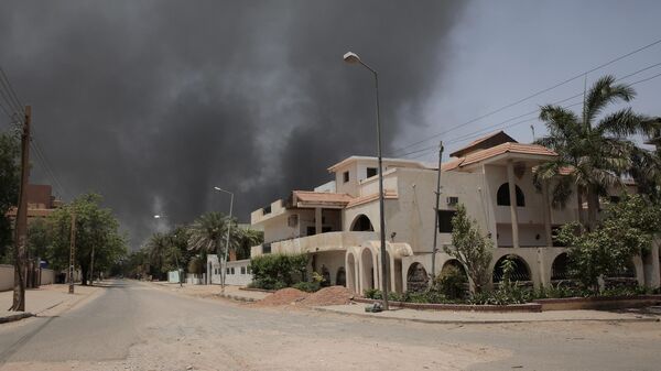 Smoke is seen rising from a neighborhood in Khartoum, Sudan, Saturday, April 15, 2023.  - Sputnik Africa