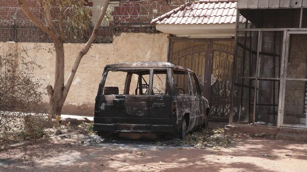 A destroyed vehicle is seen in southern in Khartoum, Sudan, Thursday, April 20, 2023 - Sputnik Africa