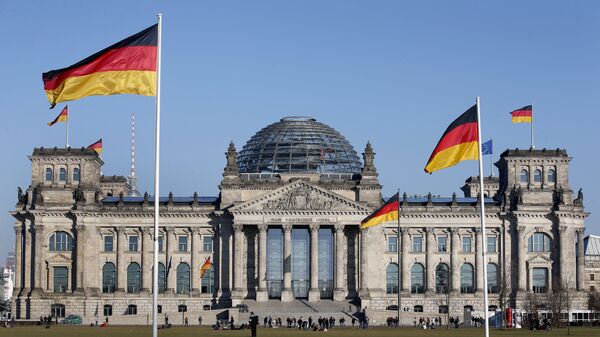 German flags wave in front of the Reichstag building, host of the German Federal Parliament Bundestag, in Berlin, Germany. (File) - Sputnik Africa