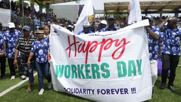 Nigerian workers march during the Labor Day Celebration Parade at the Mobolaji Johnson Arena in Lagos, Nigeria, Monday, May 1, 2023.  - Sputnik Africa