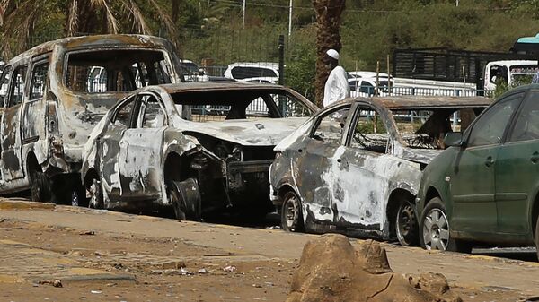 Burned cars remain at the square where the military cleared the opposition sit-in camp on June 3, in Khartoum, Sudan, Monday, June 17, 2019.  - Sputnik Africa