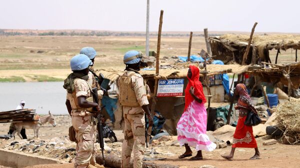 Senegalese soldiers of the UN peacekeeping mission in Mali MINUSMA (United Nations Multidimensional Integrated Stabilisation Mission in Mali) patrol on foot in the streets of Gao, on July 24, 2019 - Sputnik Africa