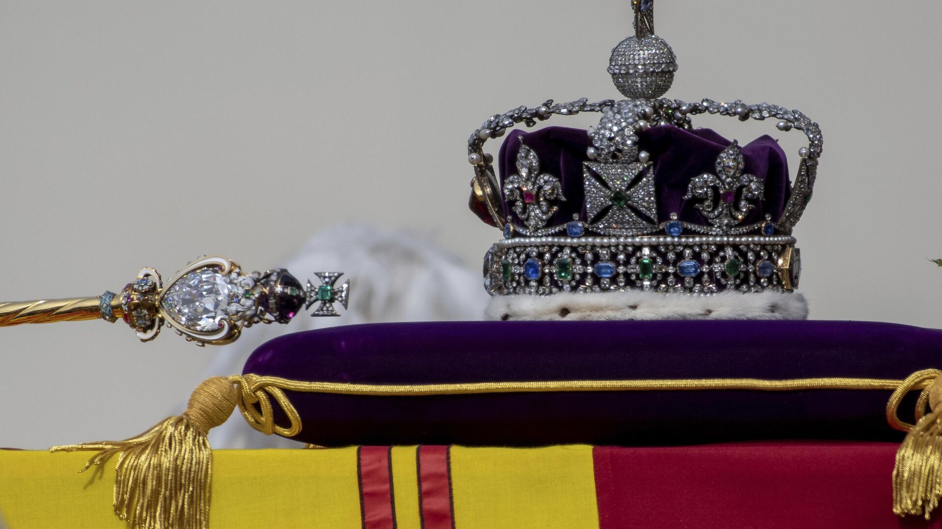 The Sovereign's Scepter with Cross, left, and the Imperial State Crown, sit on the coffin of Queen Elizabeth II as it passes through Horse Guards Parade during her state funeral in London, Monday, Sept. 19, 2022.  - Sputnik Africa, 1920, 07.05.2023