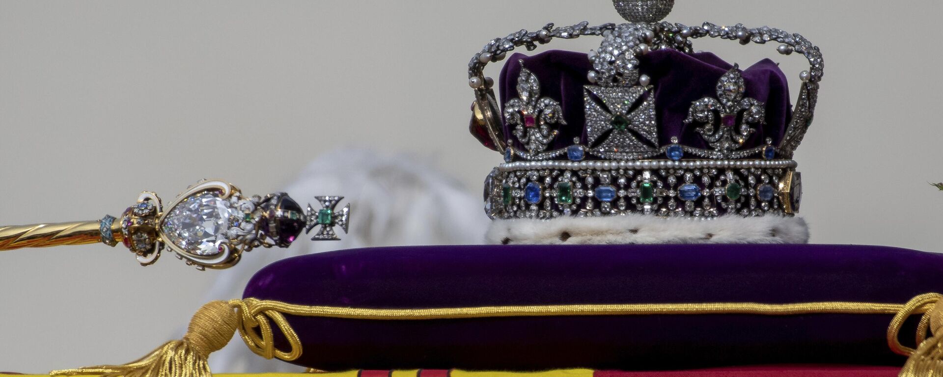 The Sovereign's Scepter with Cross, left, and the Imperial State Crown, sit on the coffin of Queen Elizabeth II as it passes through Horse Guards Parade during her state funeral in London, Monday, Sept. 19, 2022.  - Sputnik Africa, 1920, 07.05.2023