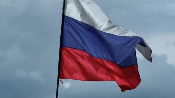 The Russian flag is flying at the entrance to the Khakhovskaya thermal power plant in the Kherson region.  - Sputnik Africa