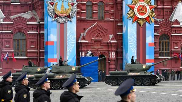 T-34-85 tanks make their way onto Red Square for the Victory Day parade. - Sputnik Africa