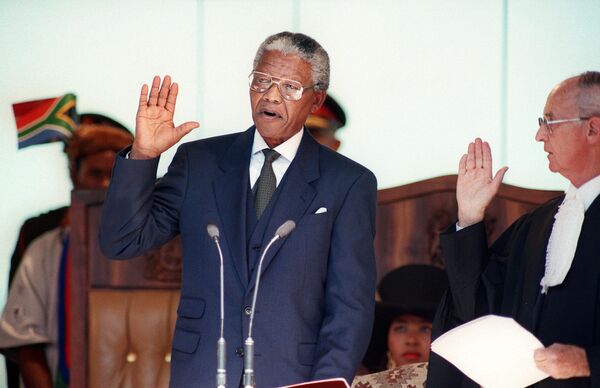 Mandela takes the oath on May 10, 1994 during his inauguration at the Union Building in Pretoria. - Sputnik Africa