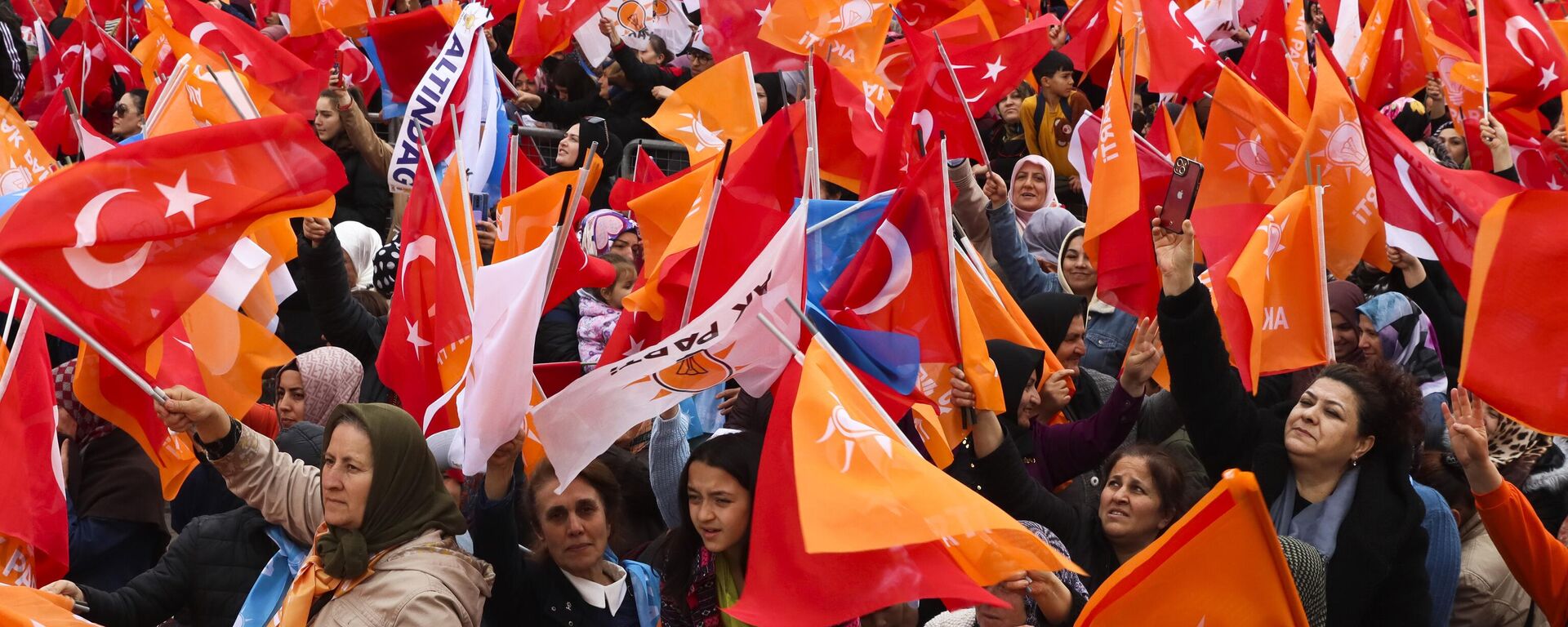 People waves Turkish and AK ruling party flags as they listen to Turkish President and People's Alliance's presidential candidate Recep Tayyip Erdogan during an election campaign rally in Ankara, Sunday, April 30, 2023. Presidential elections in Turkiye are scheduled to take place on May 14. - Sputnik Africa, 1920, 12.05.2023