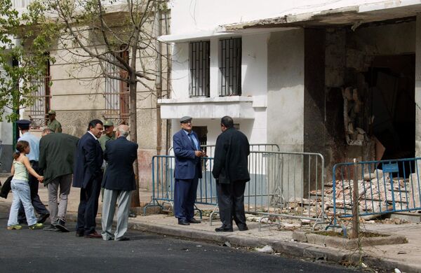 Members of the Jewish community gather before the damaged Jewish Community Center that was hit Friday night by an explosion. Picture taken on Saturday 17 May 2003. - Sputnik Africa
