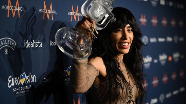 Singer Loreen performing on behalf of Sweden poses with the trophy after winning the final of the Eurovision Song contest 2023 on May 14, 2023 at the M&S Bank Arena in Liverpool, northern England - Sputnik Africa