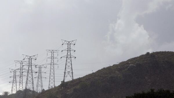 Eskom's electricity pylons snake across a hill in a Johannesburg suburb, Thursday, Nov. 24. 2011. - Sputnik Africa