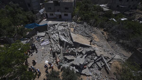 A view of the ruins of Nabhan's family home, which was destroyed in an Israeli airstrike, in Jabaliya, northern Gaza Strip, Sunday, May 14, 2023.  - Sputnik Africa