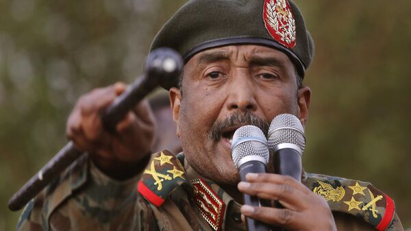 Sudanese Gen. Abdel-Fattah Burhan, head of the military council, speaks during a military-backed rally, in Omdurman district, west of Khartoum, Sudan, Saturday, June 29, 2019.  - Sputnik Africa