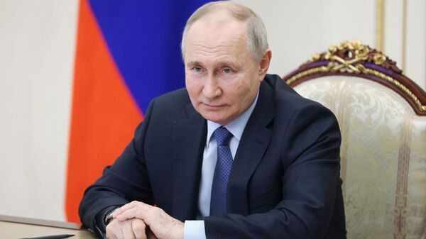 Russian President Vladimir Putin speaks by video conference to officials from Crimea, March 17, 2023. - Sputnik Africa