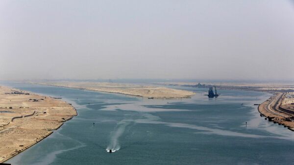 An army zodiac secures the entrance of a new section of the Suez Canal in Ismailia, Egypt - Sputnik Africa