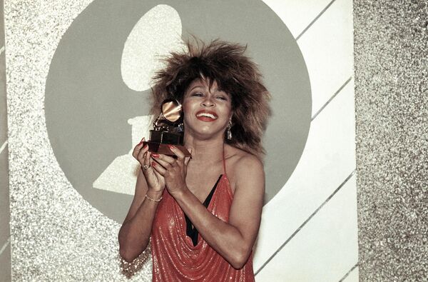 Tina Turner, Pop and R&amp;B vocalist, as holds up a Grammy Award, Feb. 27, 1985, Los Angeles, California. - Sputnik Africa