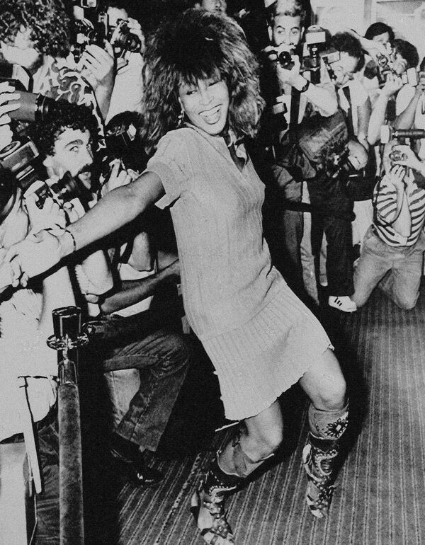 Rock star Tina Turner, 48, is shown dancing a few steps for photographers upon arrival at the Sheraton Hotel in Buenos Aires, Argentina, on January 2, 1988.   Turner performed the next day at the River Plate Stadium before an expected 60,000 fans.  - Sputnik Africa