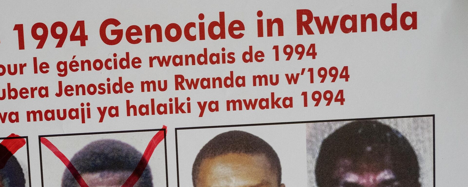 A picture taken on May 19, 2020, shows the faces of Protais Mpiranya, one of the key suspects in the 1994 Rwandan genocide, on a wanted poster on the wall at the Genocide Fugitive Tracking Unit office in Kigali, Rwanda. - Sputnik Africa, 1920, 25.05.2023