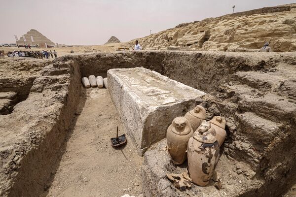 Visitors tour the site in the Saqqara necropolis south of Cairo, where archaeologists unearthed two human and animal embalming workshops, as well as two tombs, on May 27, 2023.  - Sputnik Africa