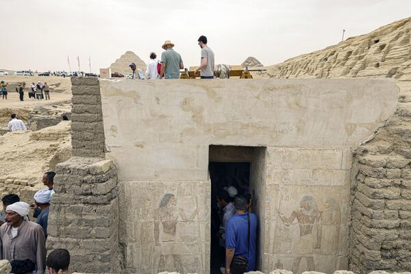 People visit newly discovered ancient tomb in the Saqqara necropolis south of Cairo, where archaeologists unearthed two human and animal embalming workshops, as well as two tombs, on May 27, 2023.  - Sputnik Africa