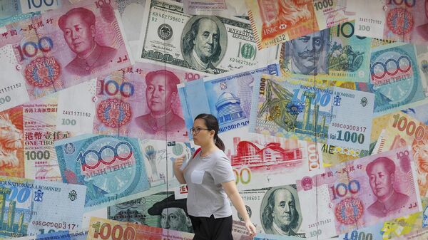  A woman walks by a money exchange shop decorated with different countries currency banknotes at Central, a business district in Hong Kong, Aug. 6, 2019. - Sputnik Africa