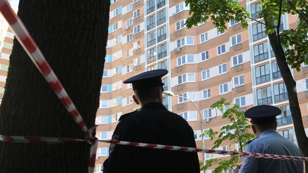 Police officers outside a residential building affected by a drone attack on Profsoyuznaya Street in Moscow.  - Sputnik Africa